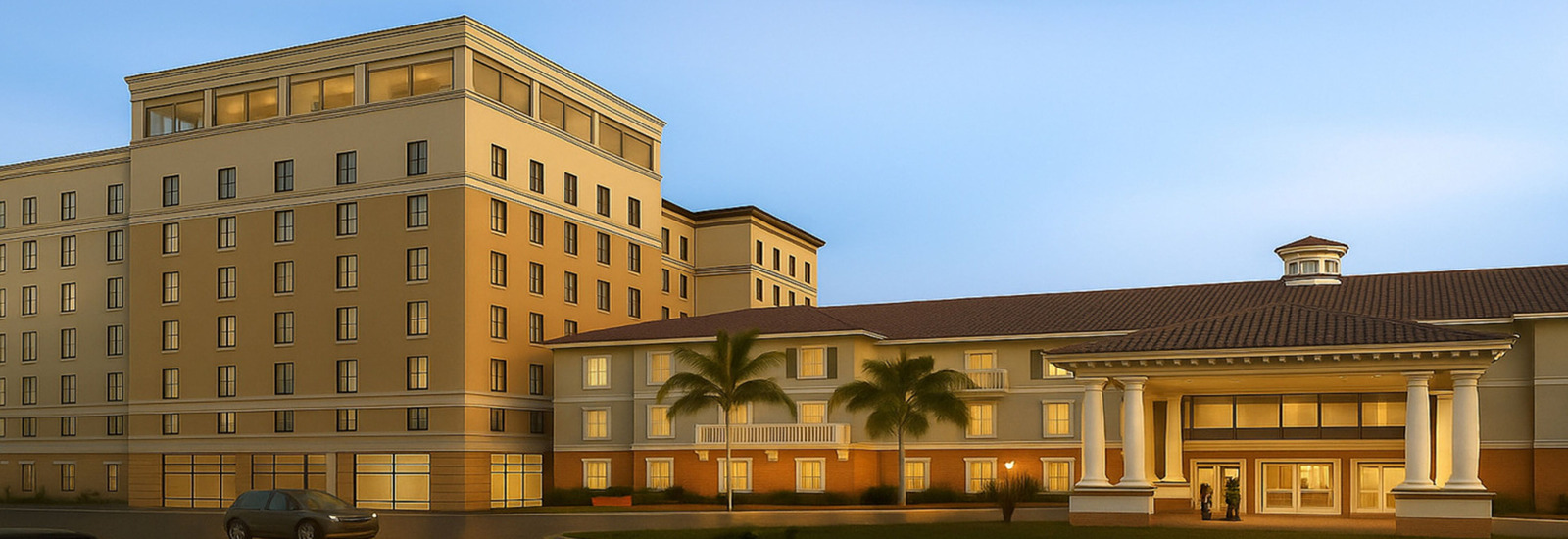 Rendering of the Atlantis Senior Tower at dusk, showing a multi-story beige building with numerous windows, palm trees in front, and grand entrance.